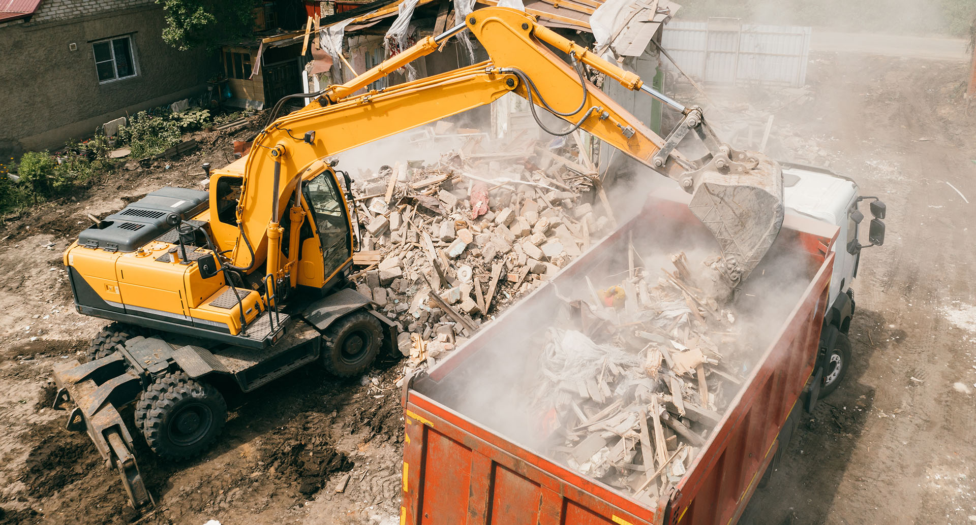 How does a SWMP work? This image shows an exacavator loading demolition waste into a tipper